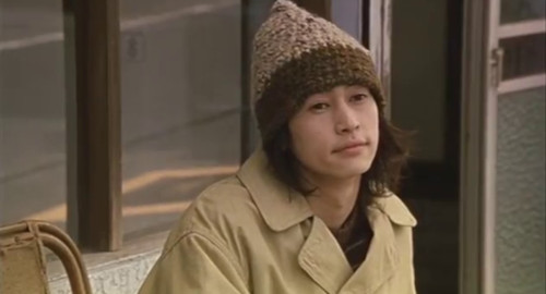 A screenshot from the film 'Laundry', of Teru (played by Yousuke Kubozuka) gazing off at nothing.