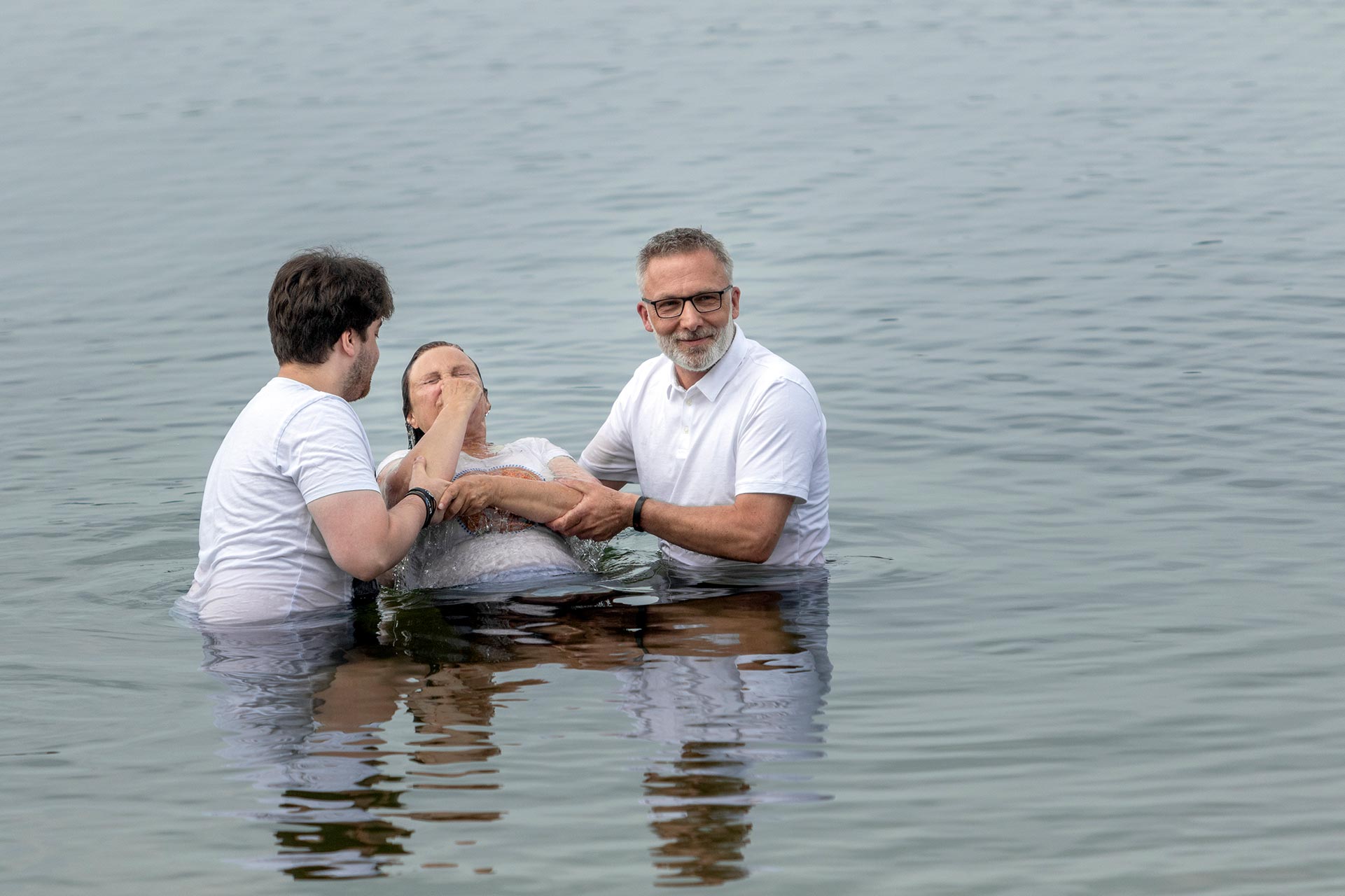A missionary baptizing new converts to Christianity