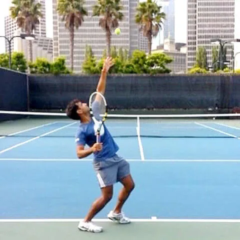 Photo of Kunal playing tennis