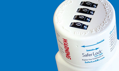 Image of a SaferLock locking cap on a white bottle.