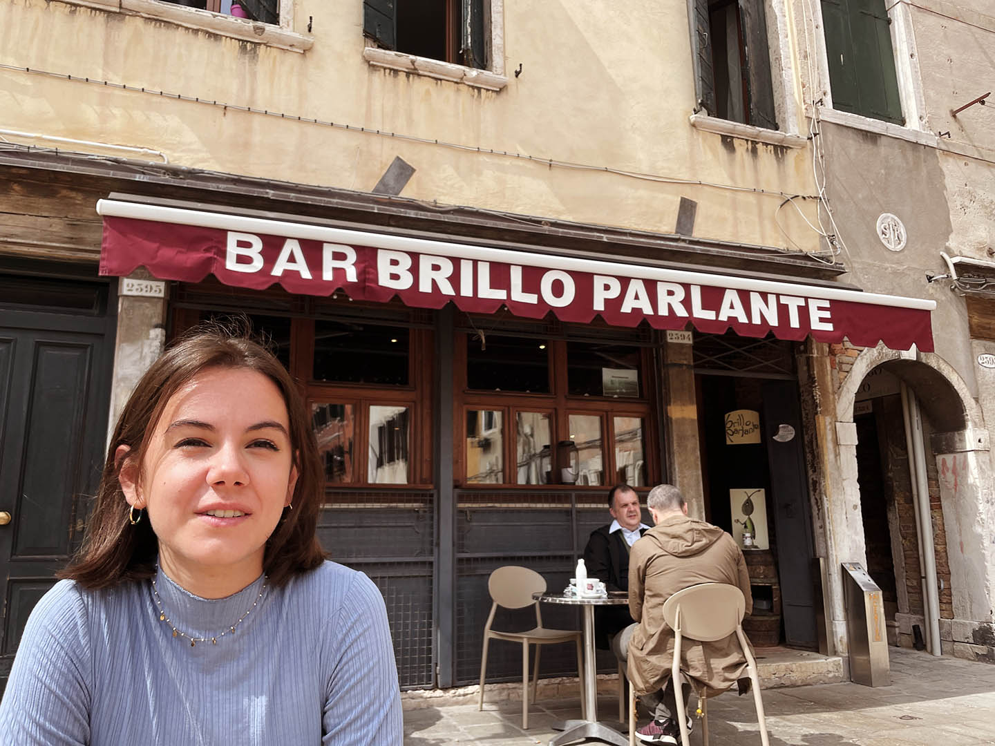 Alice contemplating the view at Brillo Parlante Alice seated at a table of Brillo Parlante