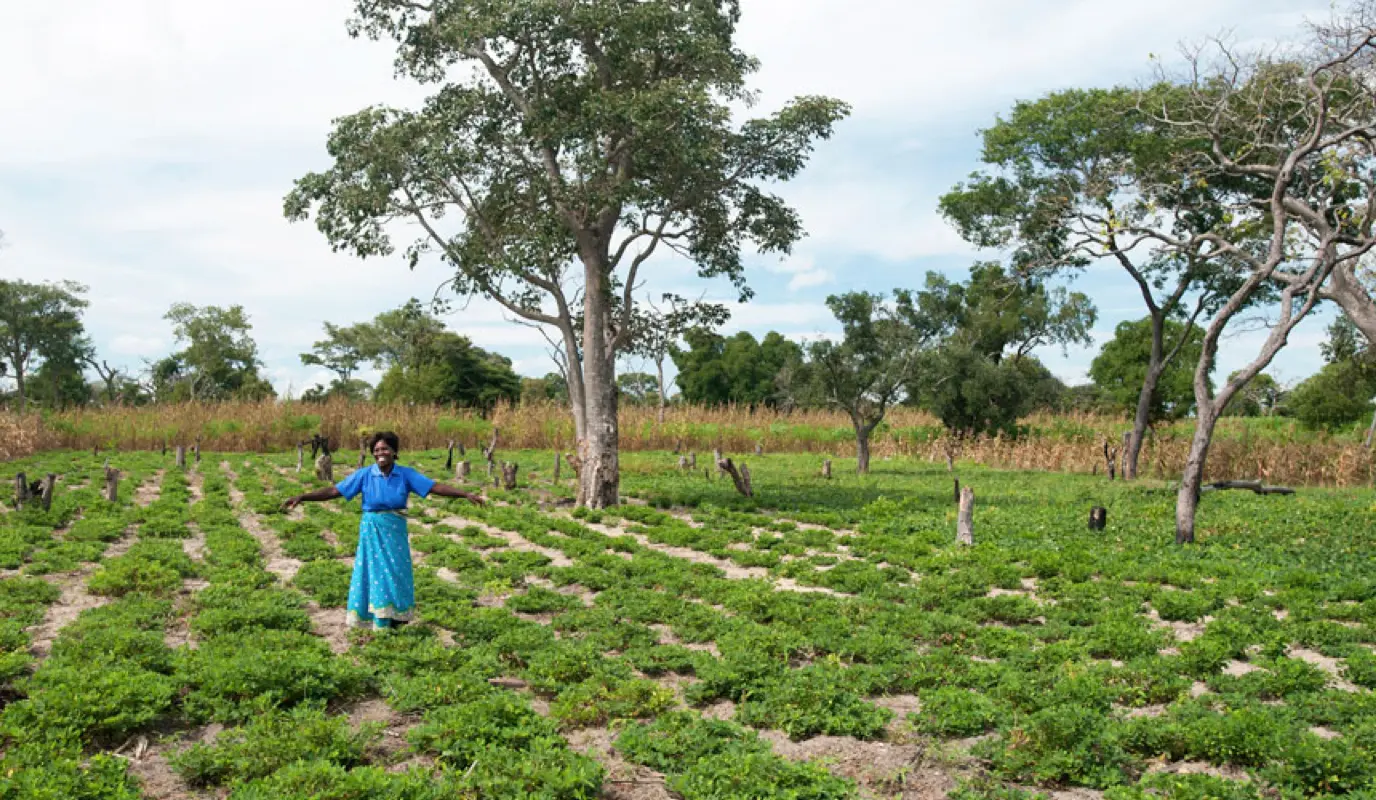 RAIN project participant Doris Makina standing on her farm.