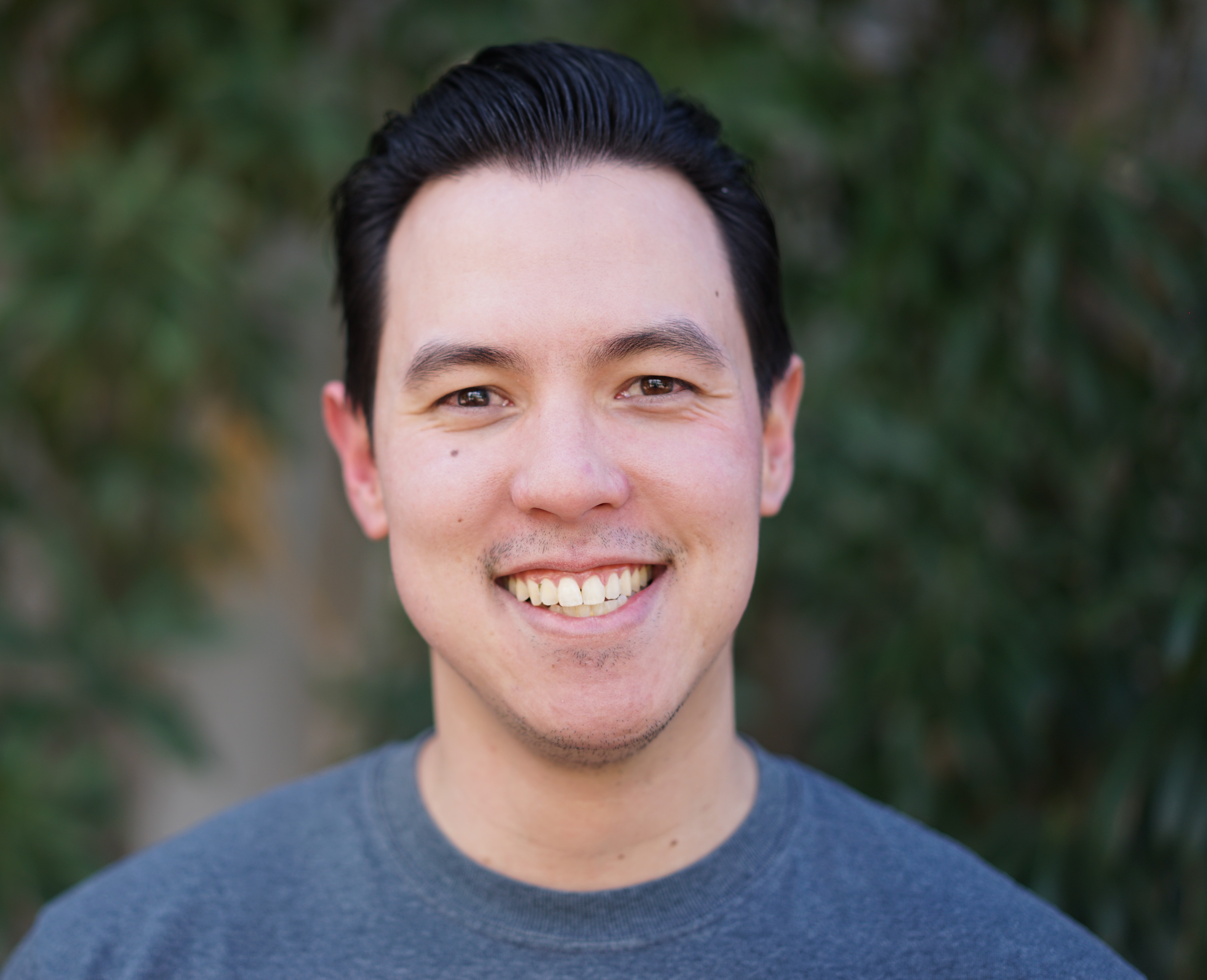 Headshot style photo of Thai Wood
