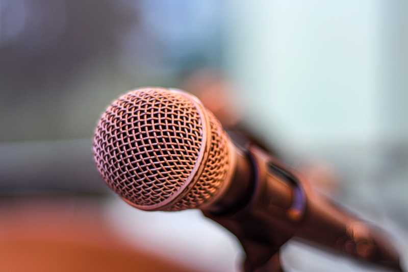 Photo of a microphone, ready for listening.