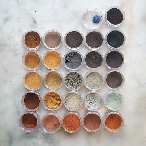A grid of powder pigments from natural sourcecs