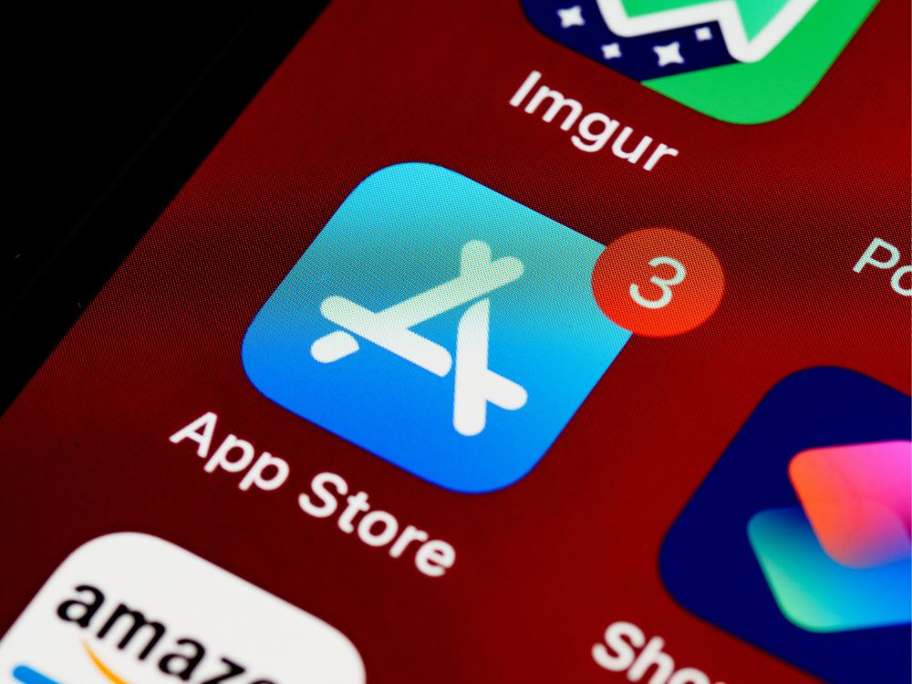 The app store app icon on a zoomed-in home screen, surrounded by other apps, with the app store app being the focal point.