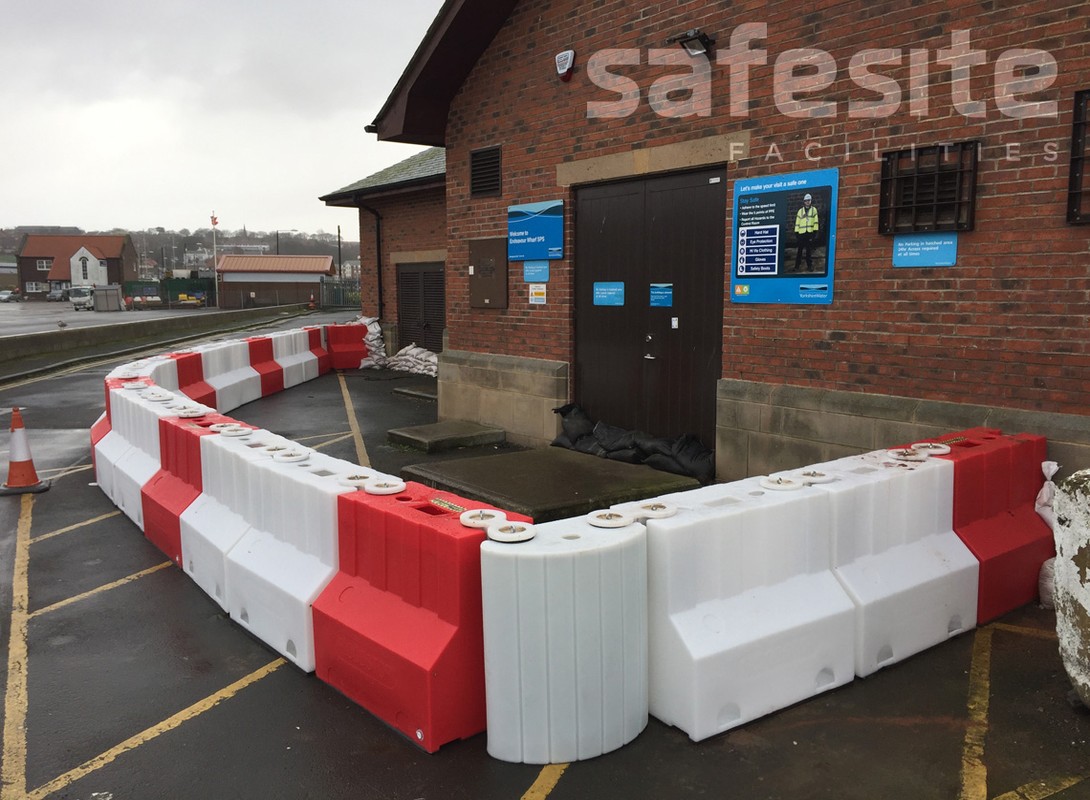 900mm flood barrier protecting building