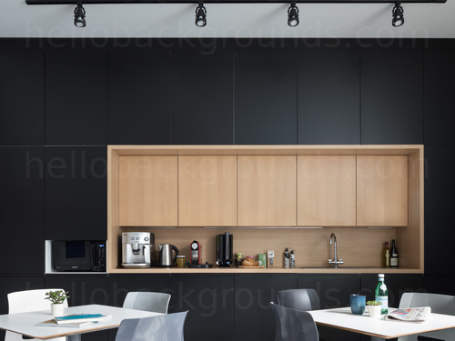 Dining area featuring plain white square tables and chairs next to wood design beverage station Skype background