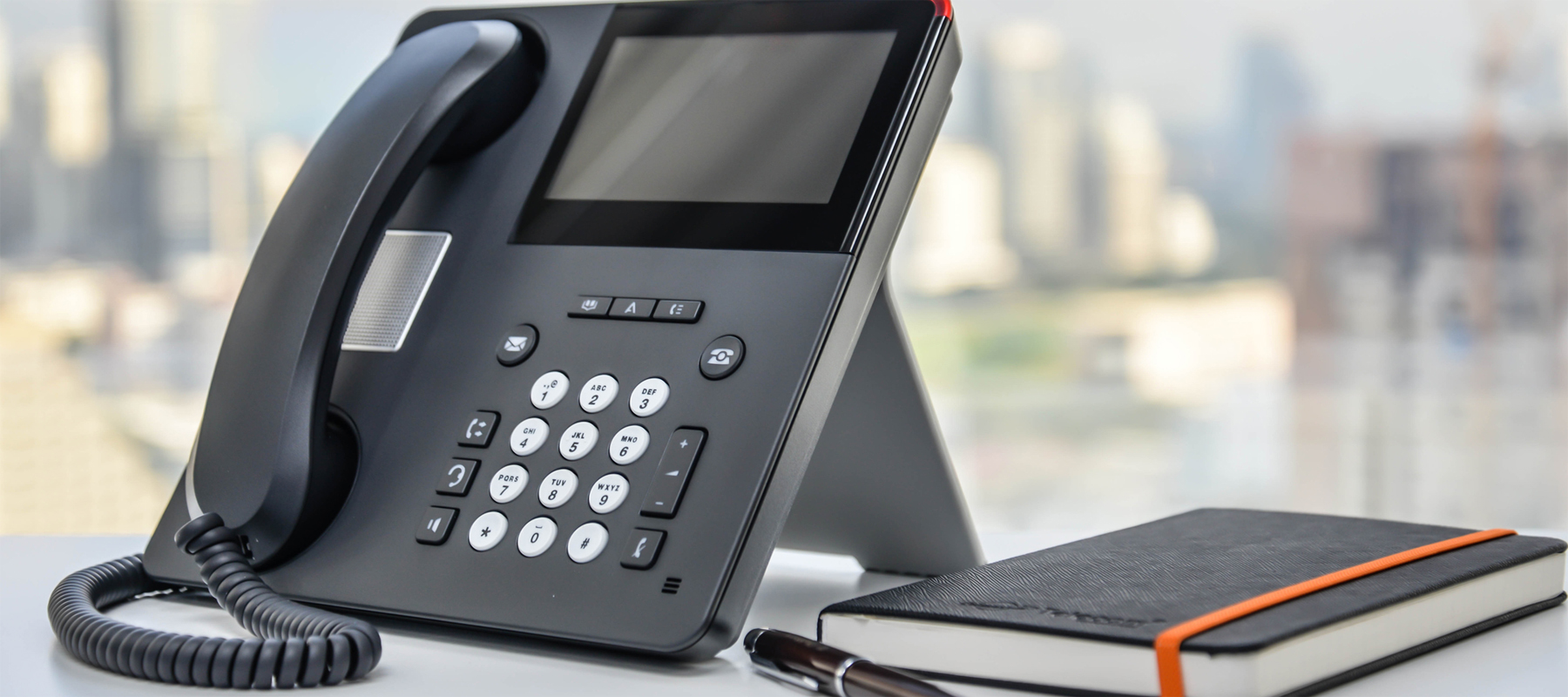 A PBX Phone System with Notebook and Pen