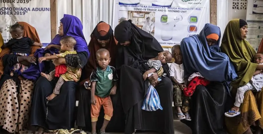 Women and children wait to be seen at the Obosibo Halane Health Centre in Mogadishu