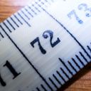 Zoomed in on the seventy two centimetre mark on a measuring tape.