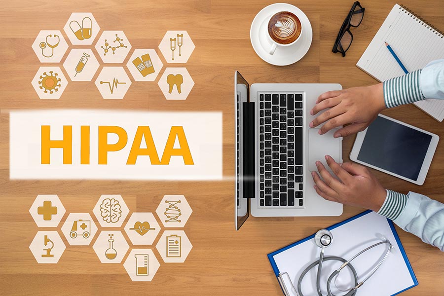 Man on a laptop practicing HIPAA-compliant managed IT services in San Marcos TX