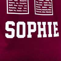 A hoodie with a student's first name printed on the back below the large number.