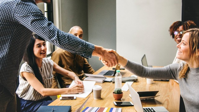 Photograph of people shaking hands