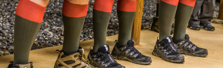 Several people wearing traditional red-topped scout socks