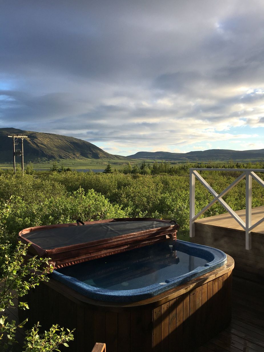 A private hot tub is by the house with picturesque view