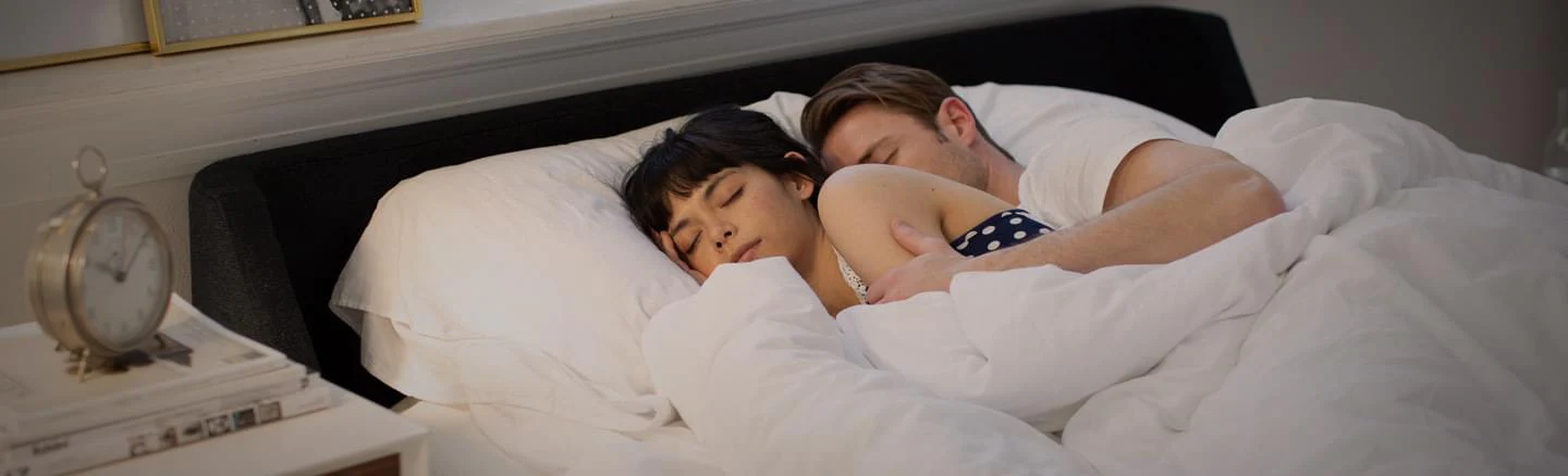 couple sleeping on the winkbed mattress