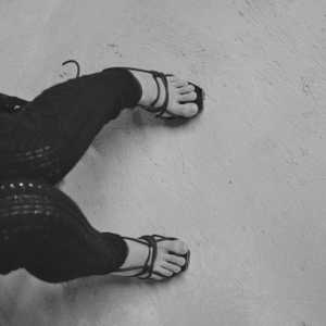 Hot woman in hight heels. Avant garde fashion. Haute de couture. Tribal postapocaliptic fashion. Foot fetish