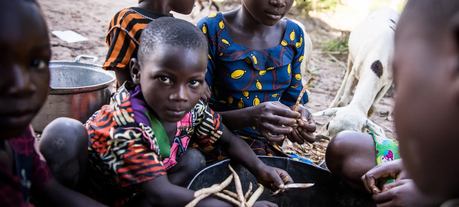 The family of Seraphin Mukalay and Joli Kabange are seen preparing beans at the village of Kakyinga, Manono Territory.