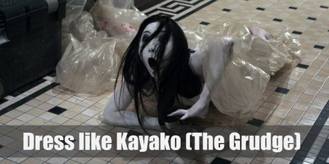 Kayako from the Grudge movies does not have extra arms, eyes, or legs. She doesn’t have scaly skin or pointed teeth.