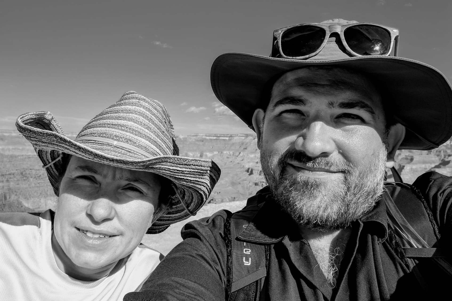A black-and-white selfie of Len and myself, with the Grand Canyon in the distance.