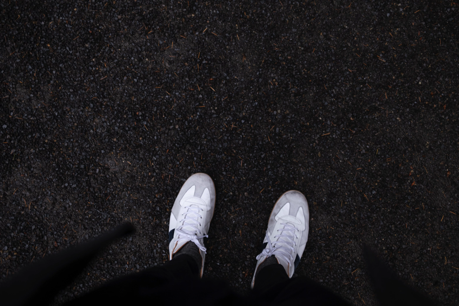 White shoes on gravel.