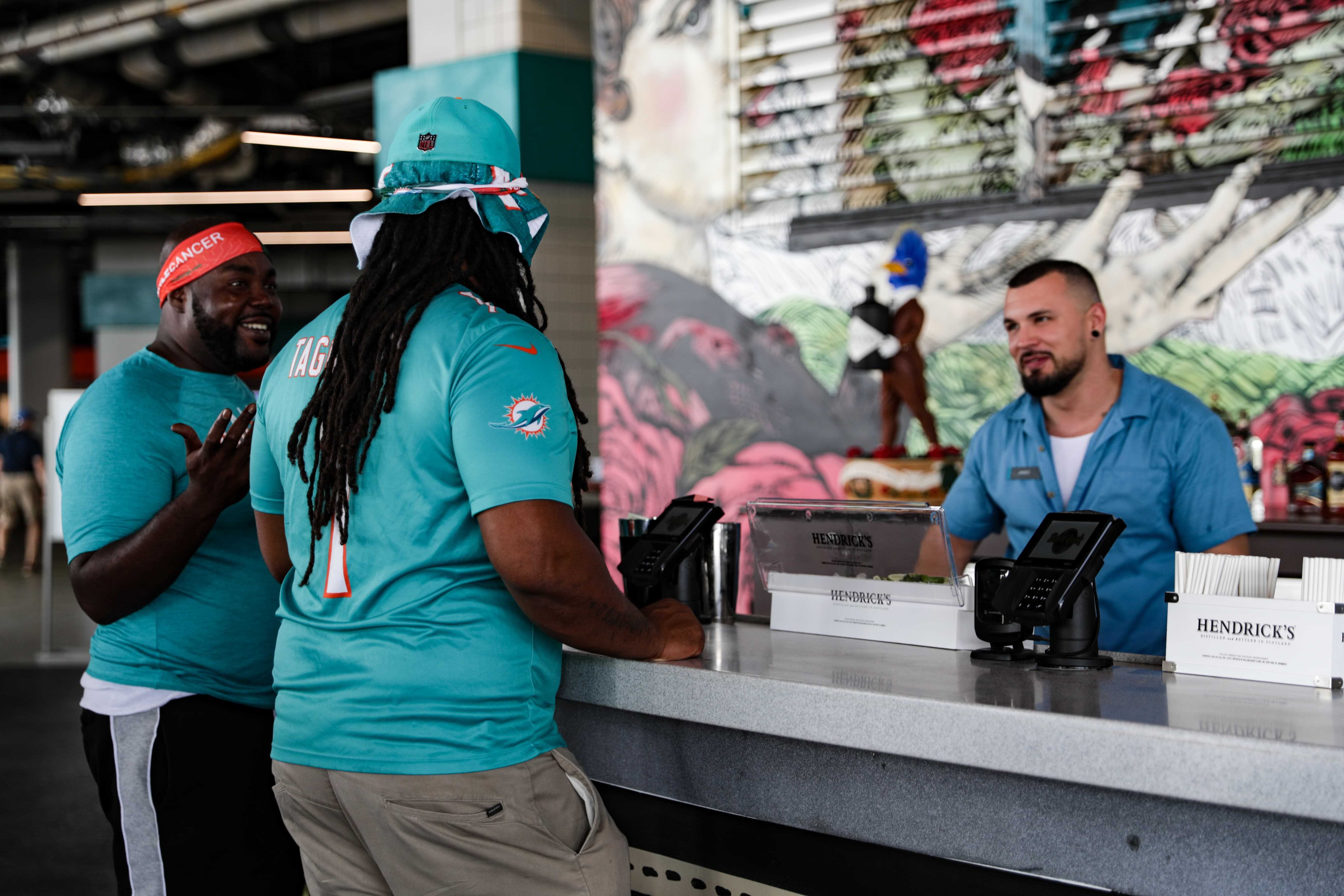 Miami Dolphins fans being served at Hard Rock Stadium concession stand