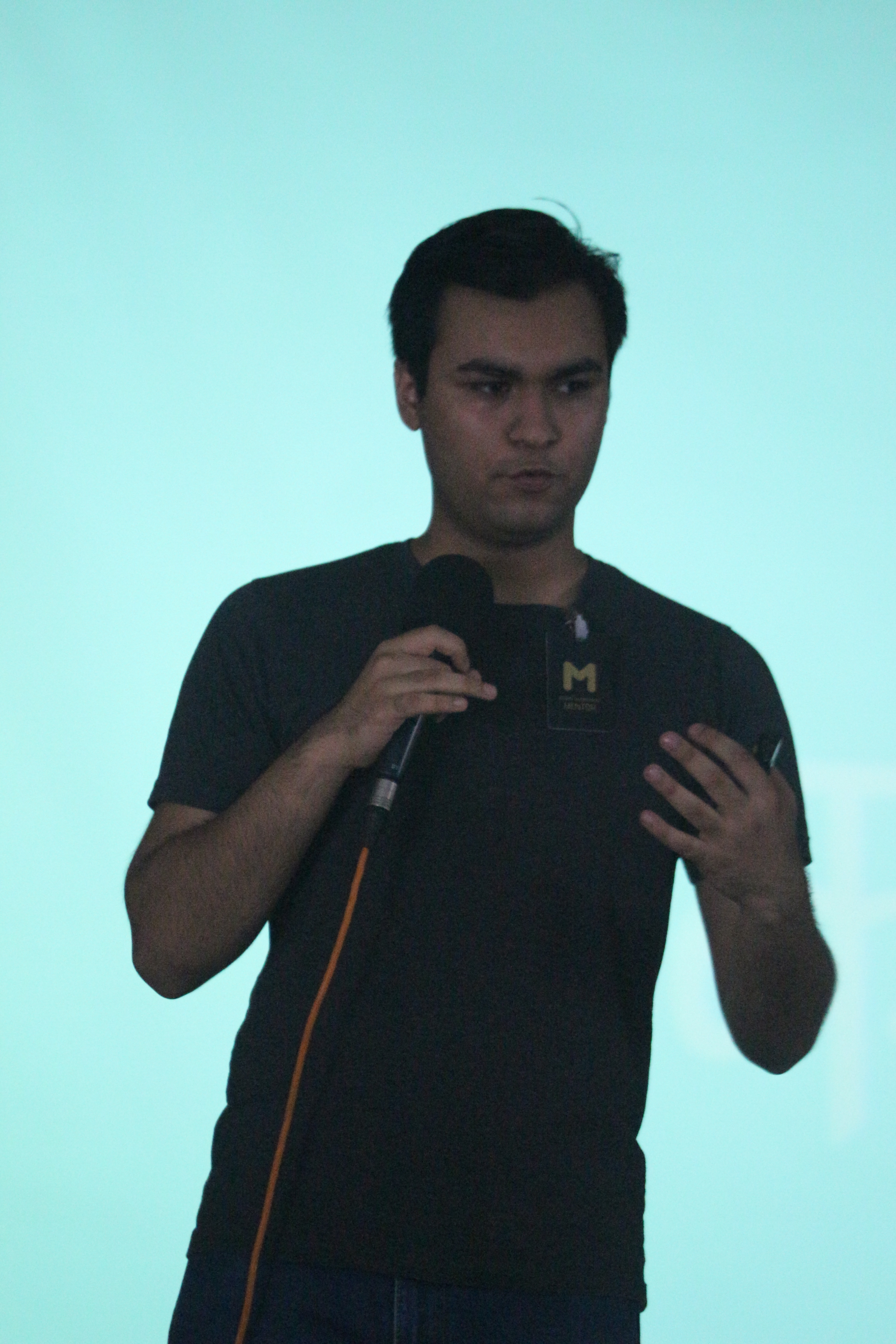 Anand Chowdhary speaking with blue background