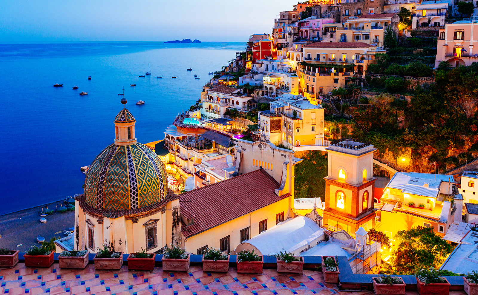 pastel-colored buildings on the amalfi coast of italy overlooking the ocean