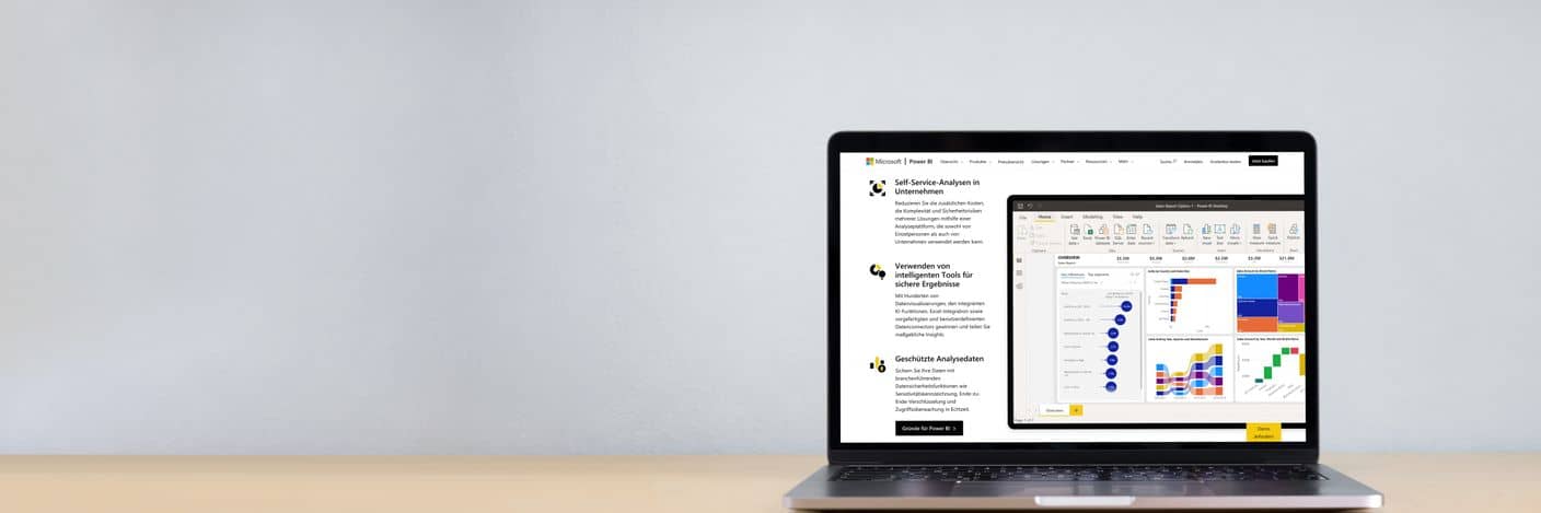 Laptop mit Power BI Laptop auf Schreibtisch mit Power BI auf Bildschirm