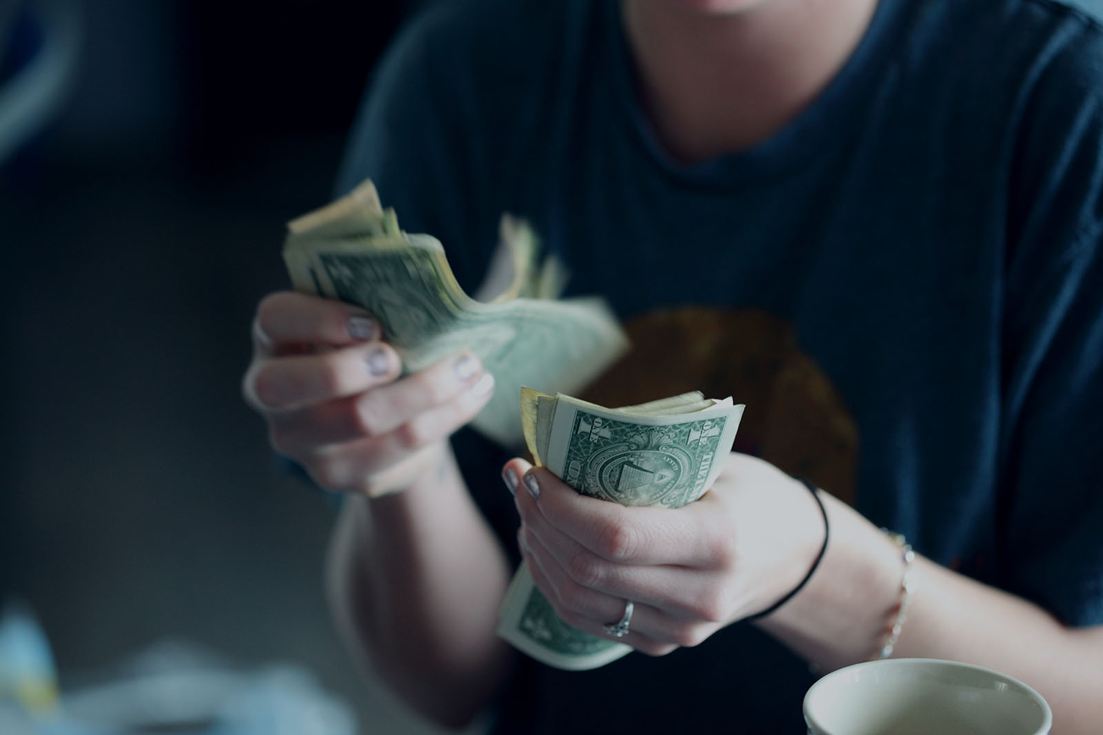 Woman counting money in hands
