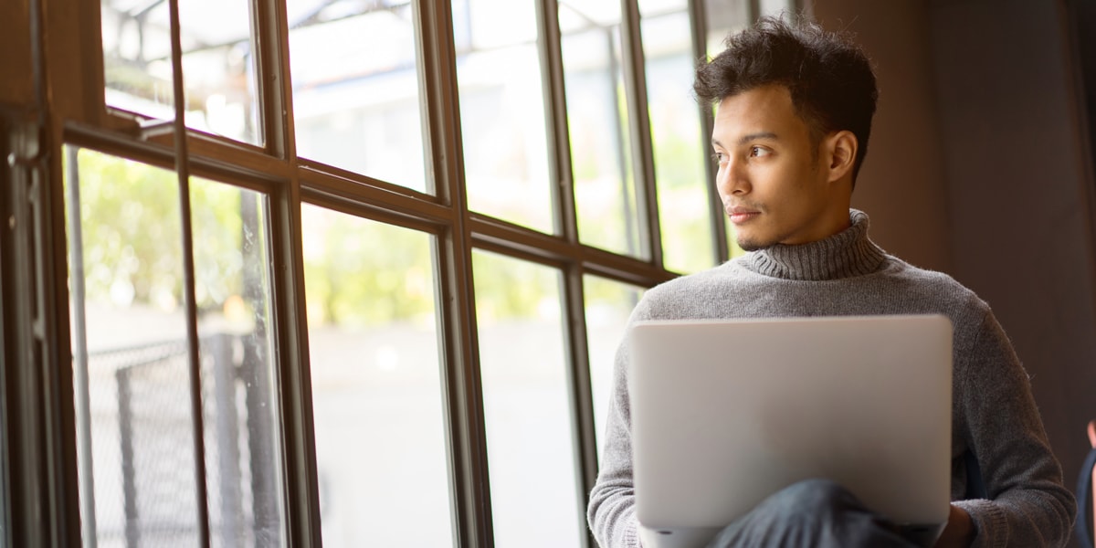 How can psychology make you a better UX designer? A UX designer working on a laptop A UX designer sitting in front of a laptop, looking sideways