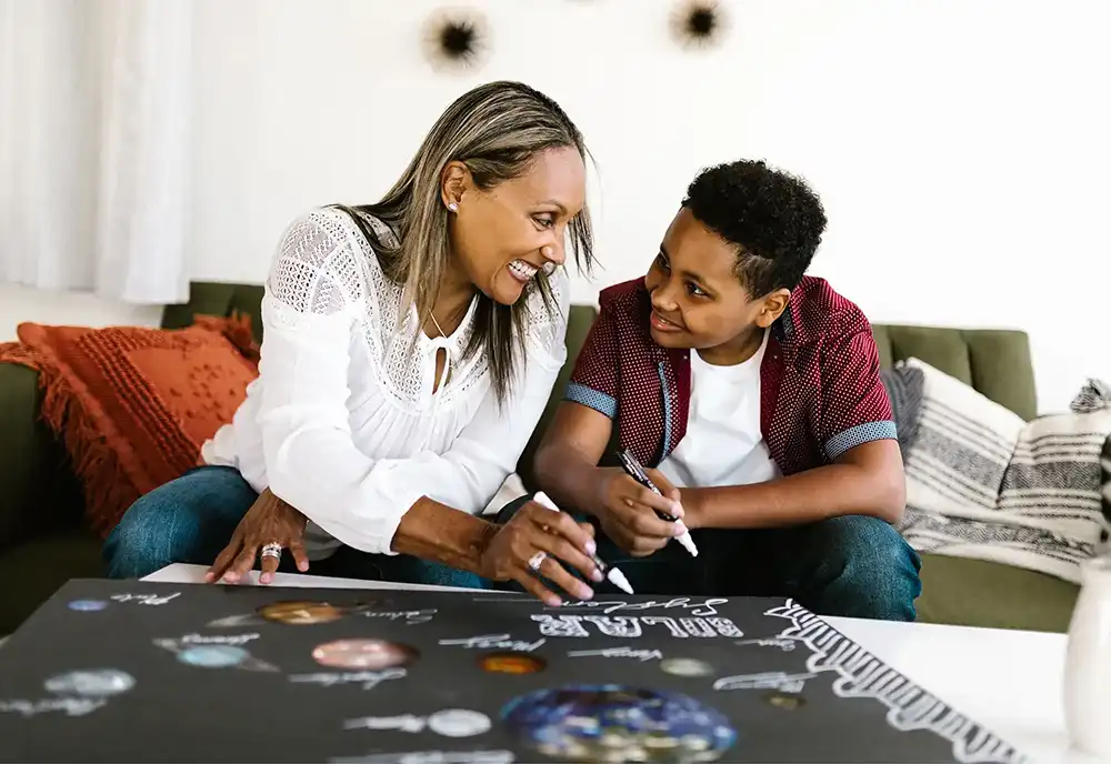 Mother and son working on an art project together