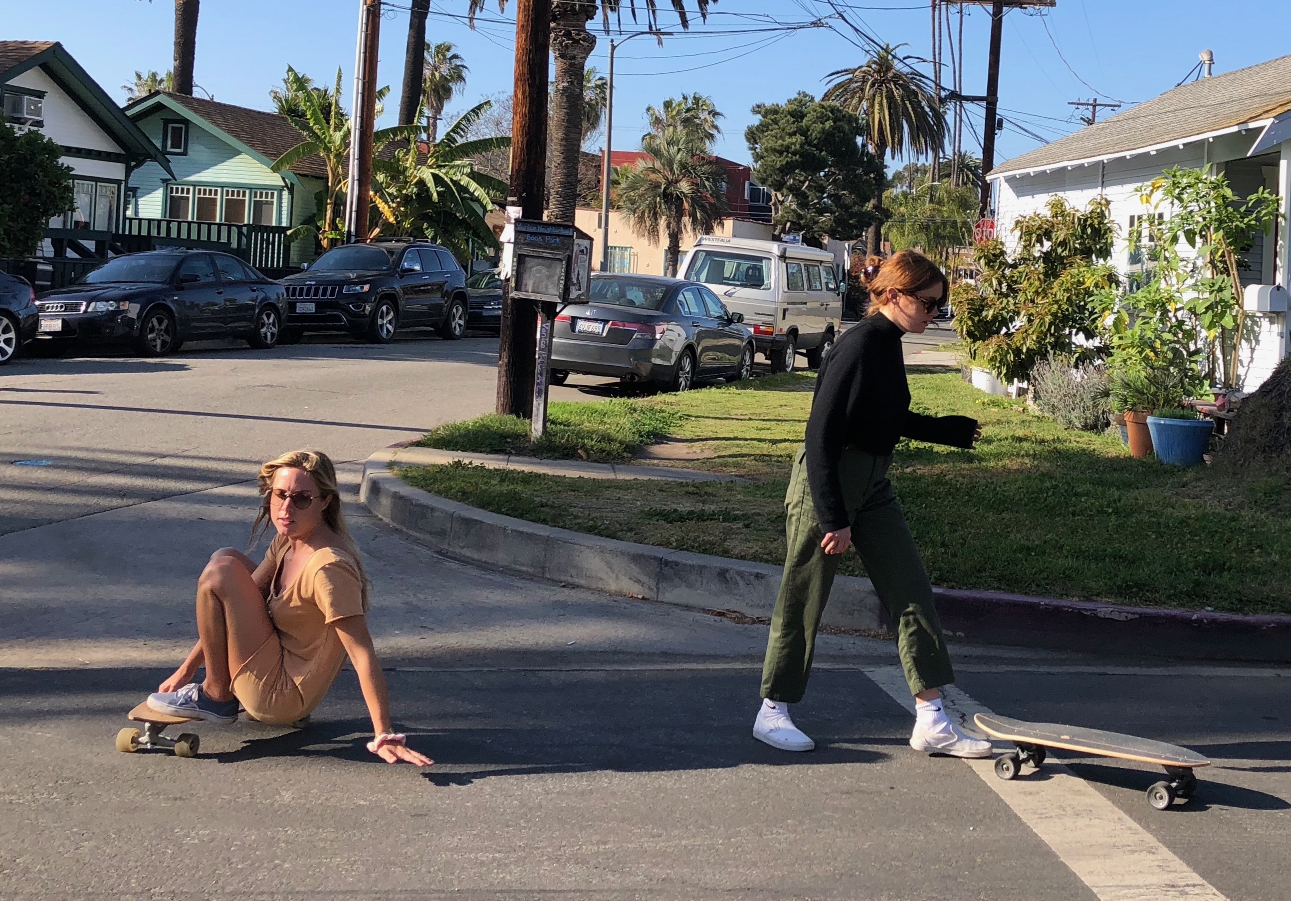 Girlswirl skateboarder doing tricks in street