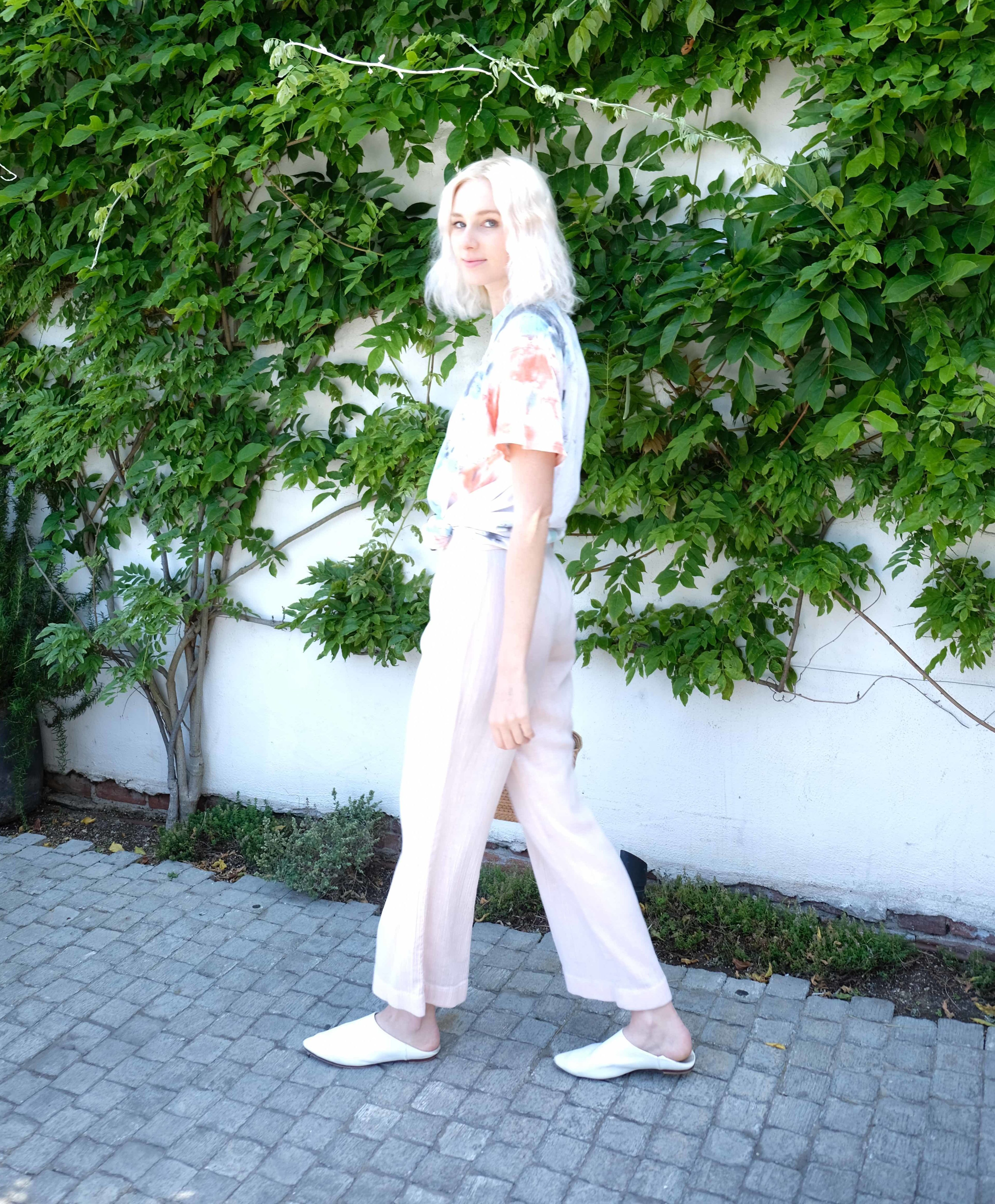 beautiful young woman with white hair in pastel outfit