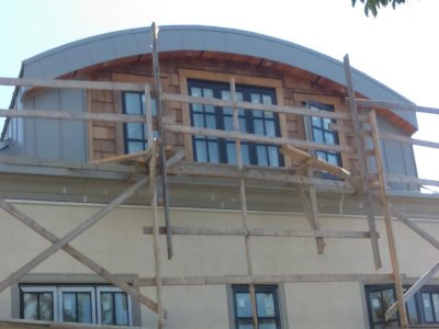 In progress grey metal cladding.
