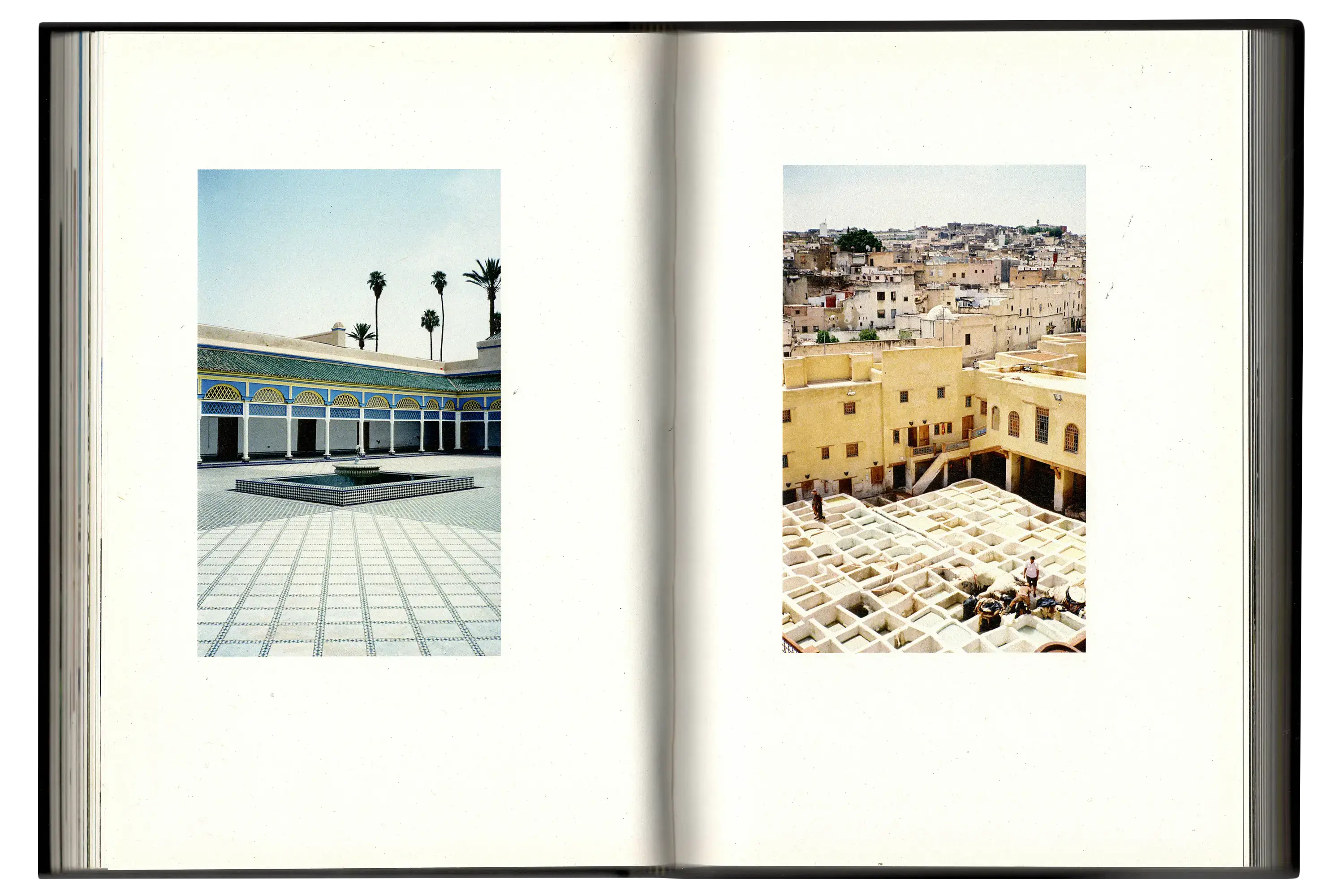 Imperfect Photo Book - left image of large courtyard with intricate mosaic pattern, right page image looking down on field of old run down buildings
