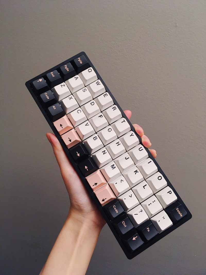 Holding onto the completed keyboard, which is small enough to comfortably hold in one hand.