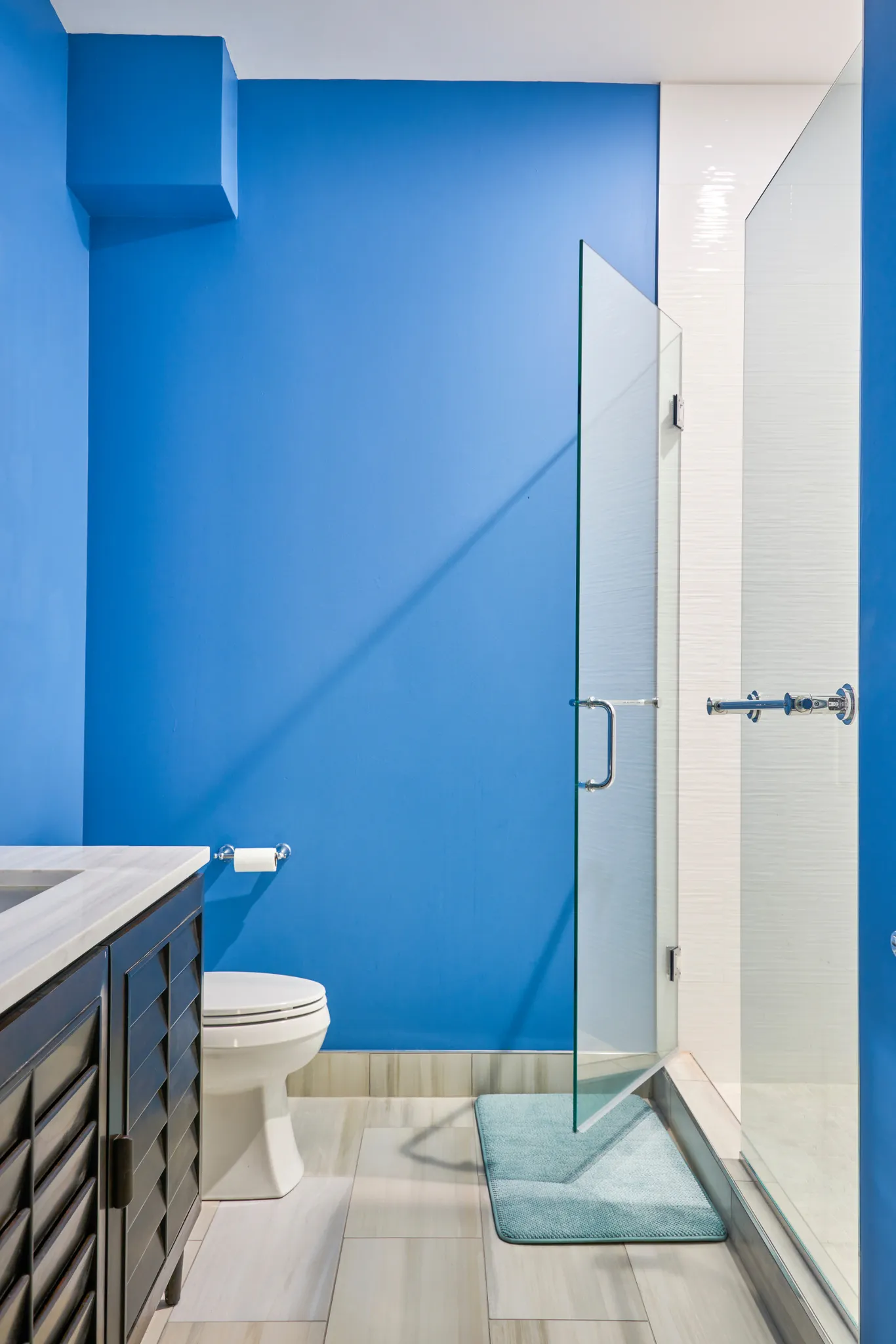 Phoenix, AZ condo - Sky-blue bath with walk-in shower