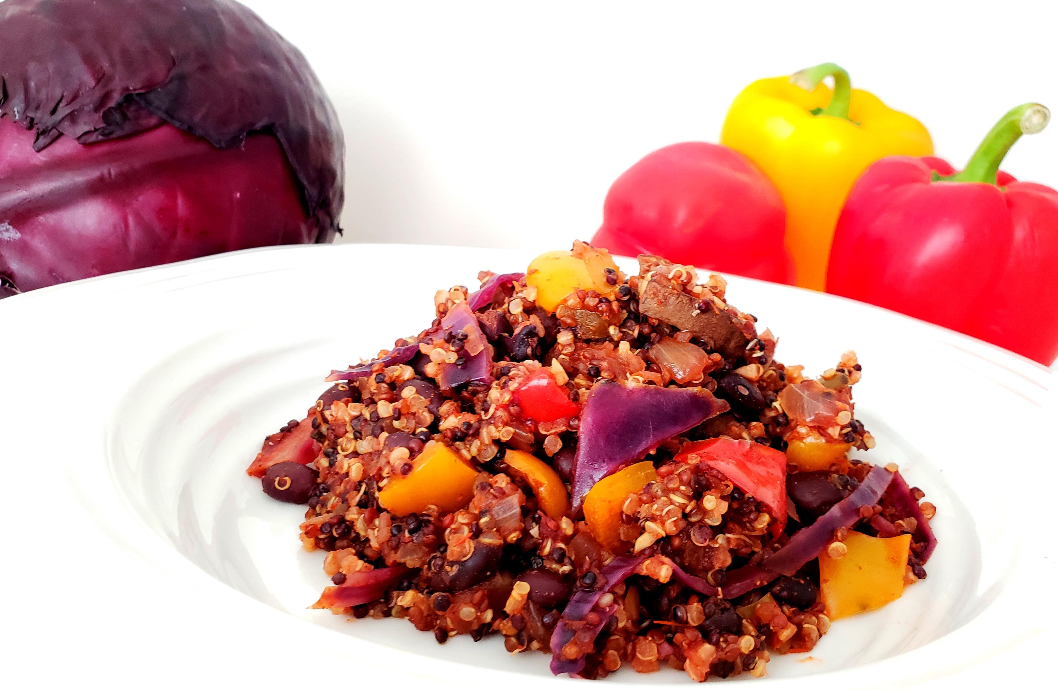 Cooked Mexican Quinoa with Peppers, red cabbage, and Mushrooms in bowl