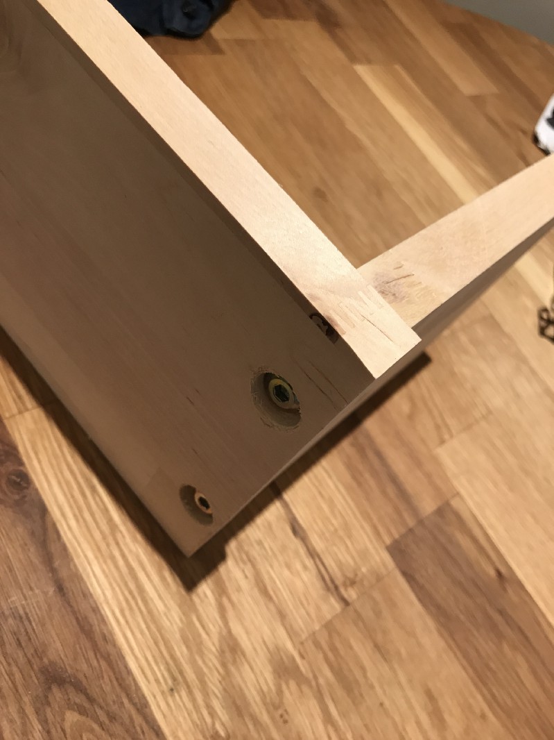 A counter sunk hole for the screws. This can be covered with a cap to conceal