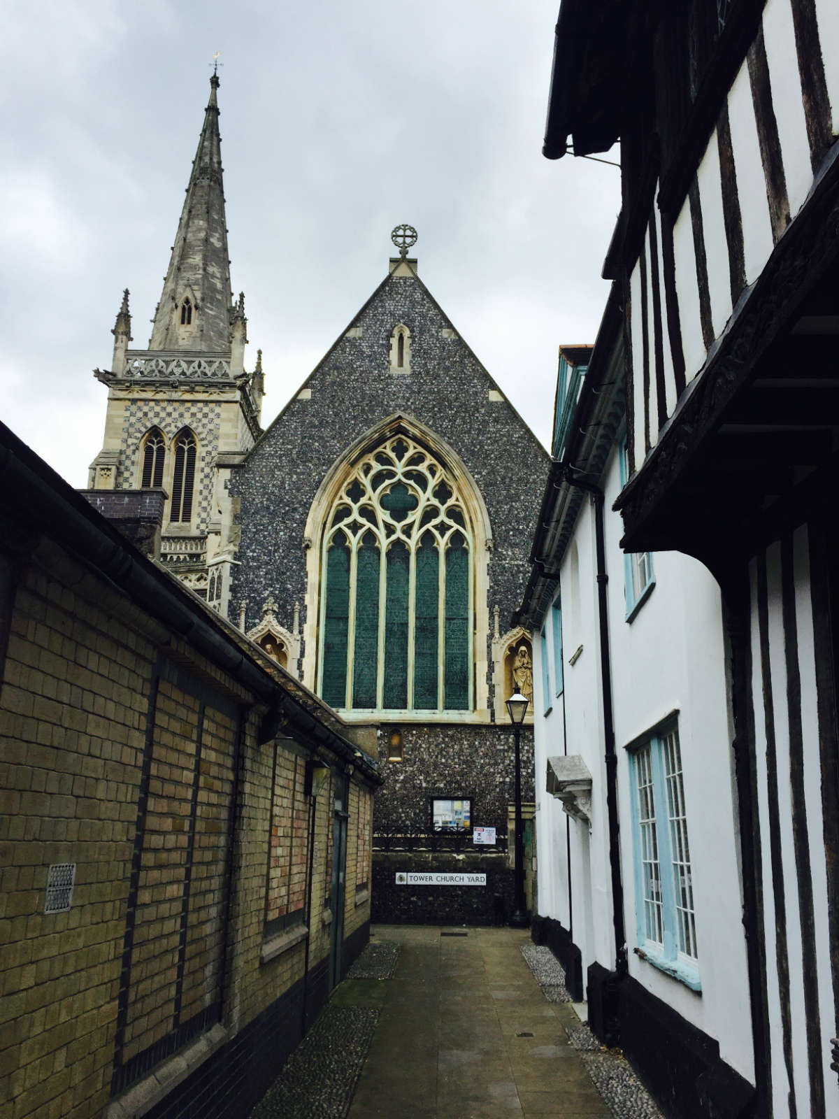 Lane leading to an old, tall church