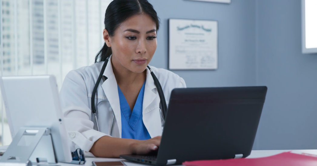 Healthcare professional on laptop