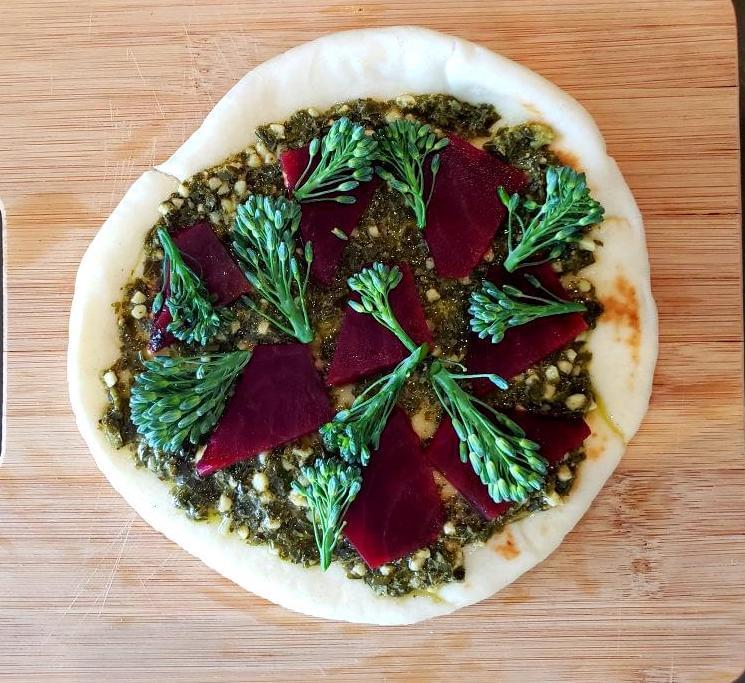 Flatbread with pesto base, beets, broccolini