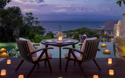 Enjoy a romantic dinner in your private ocean-view villa.