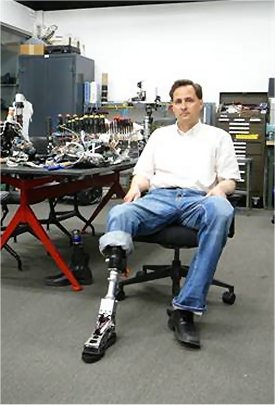 HUgh Herr, MIT researcher and double amputee, shows off one of his prosthetic legs.