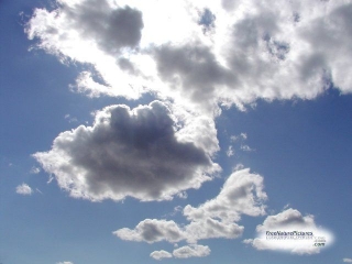Photo of sunlight shining through clouds