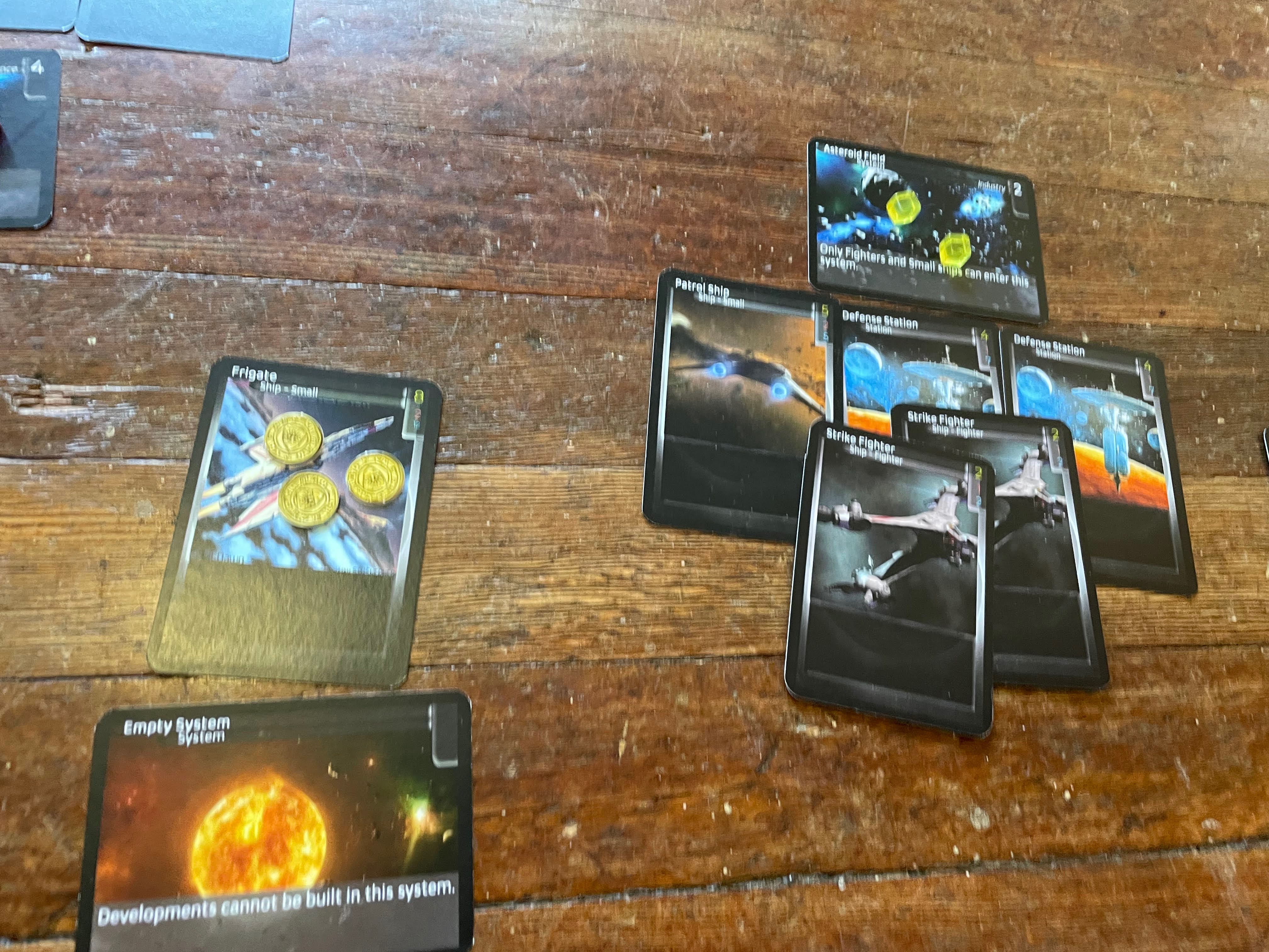 The Asteroid Field, with two Defense Stations, a Patrol ship, and two Fighters.