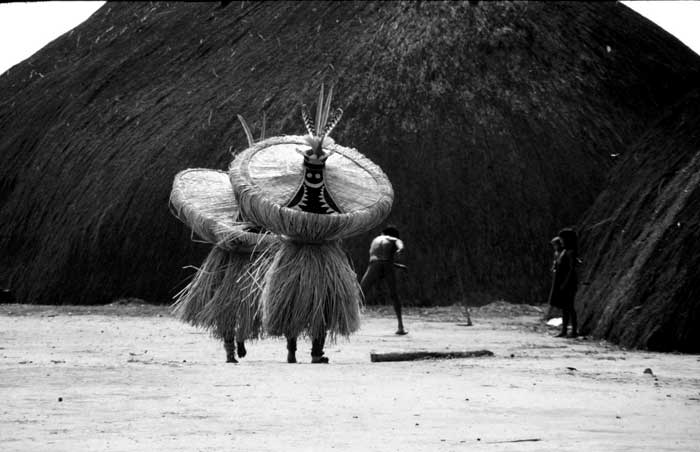 Two Kuikuro Indians dance in celebration of the “whirlwind” spirit.