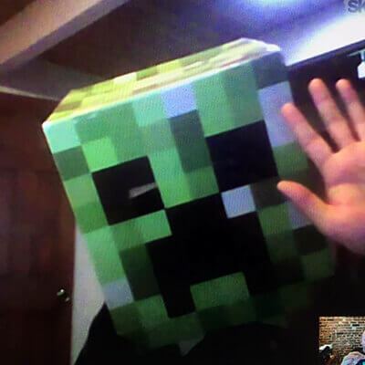 Scott Roberts wearing a creeper mask from Minecraft